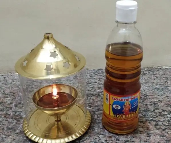 Akhand Diya from Borosil with an oil bottle nearby
