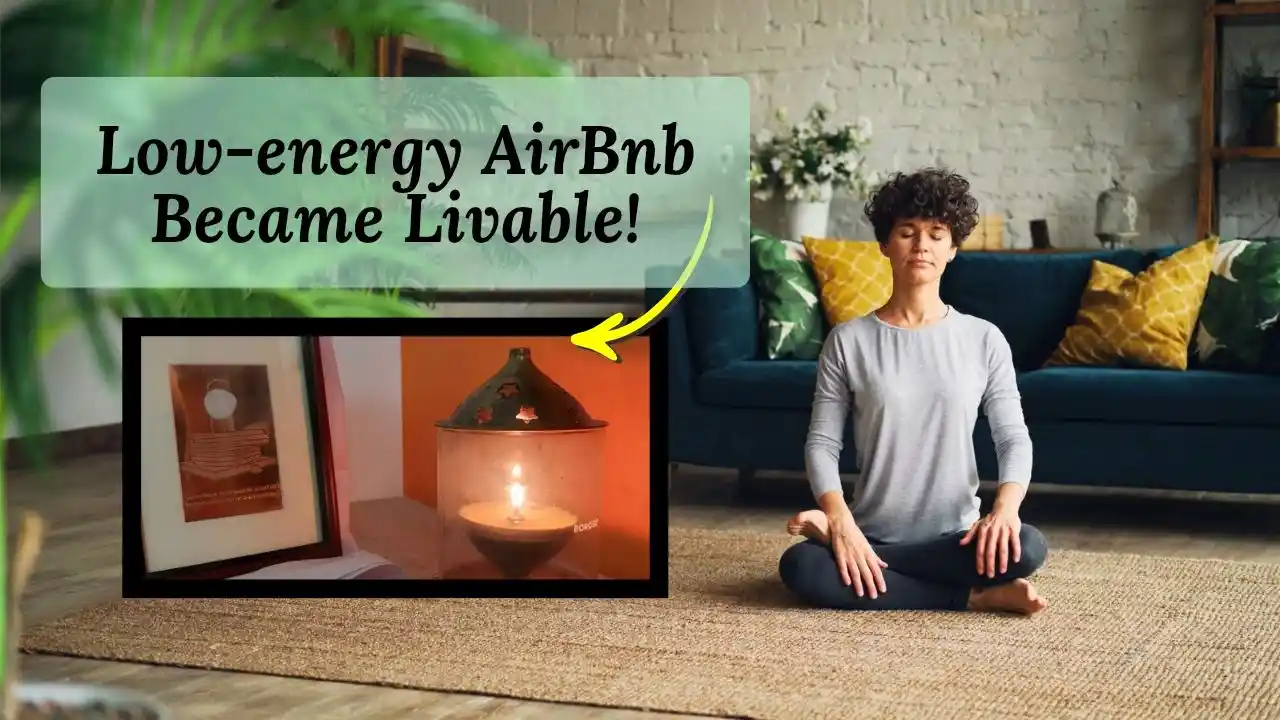 Sadhaka sitting in a room with dhyanalinga yantra and akhand diya depicting how I transformed a low energy Airbnb room